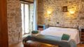 20-s586-bedroom-with-stone-walls-La_Torre_di_Celle
